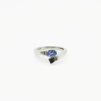 Tanzanite Ring with an Overlapping Band in 925 Silver