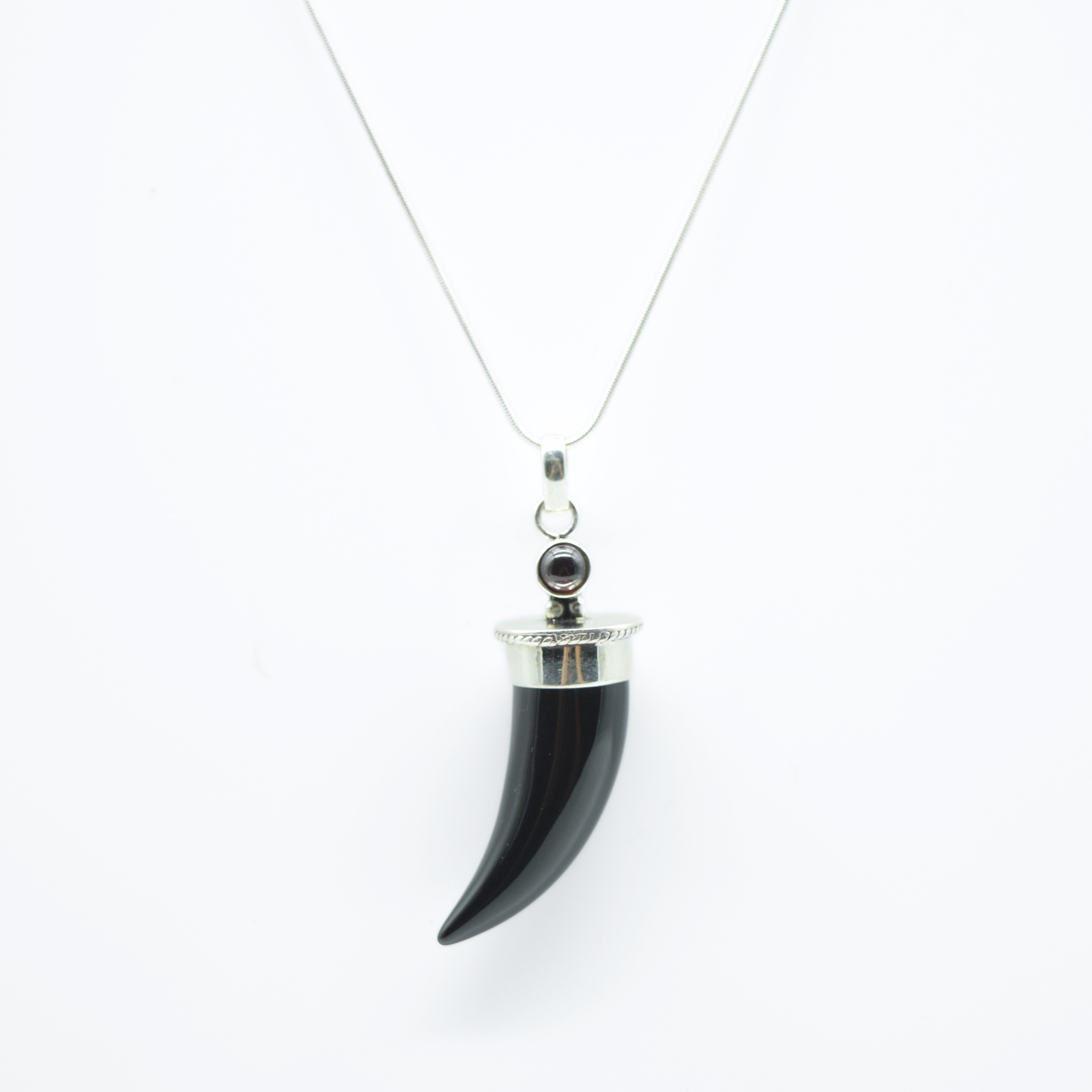 Black Tourmaline Shark's Tooth Pendant with a Garnet Accent in 925 Silver